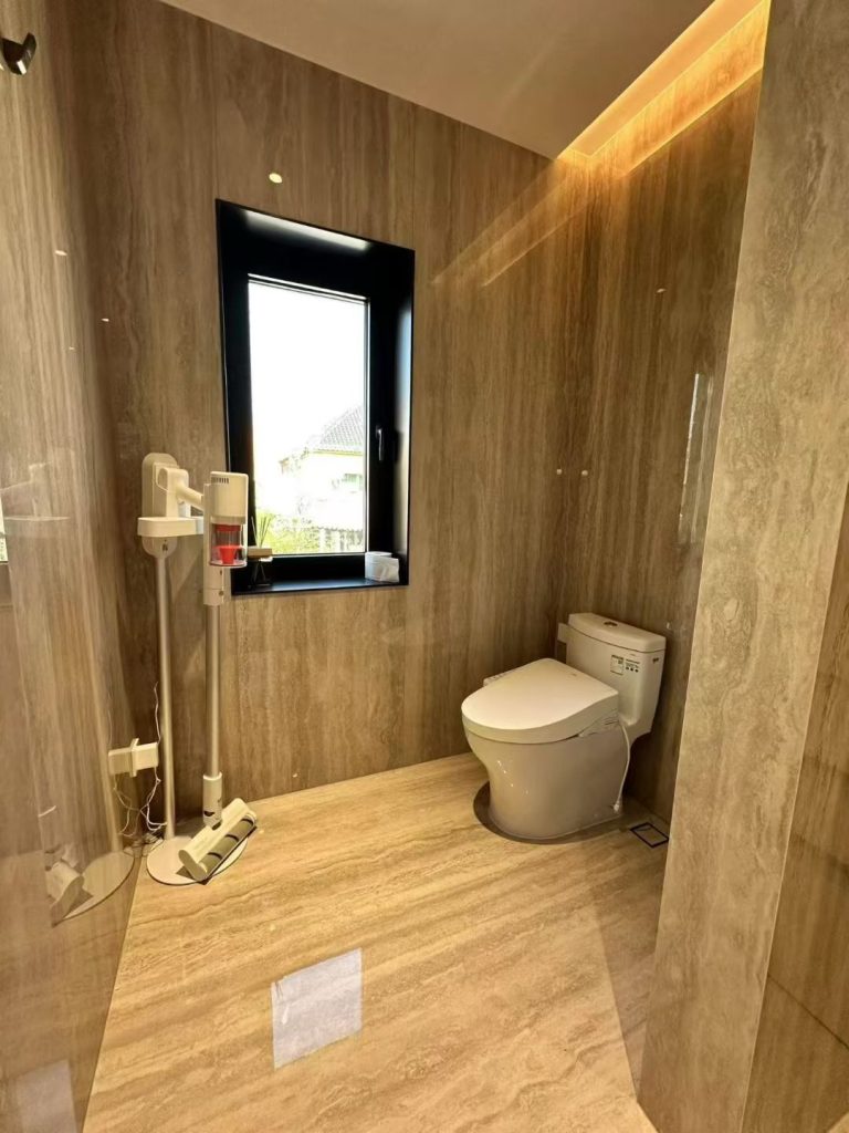 Bathroom renovation with both sintered stone and quartz options displayed