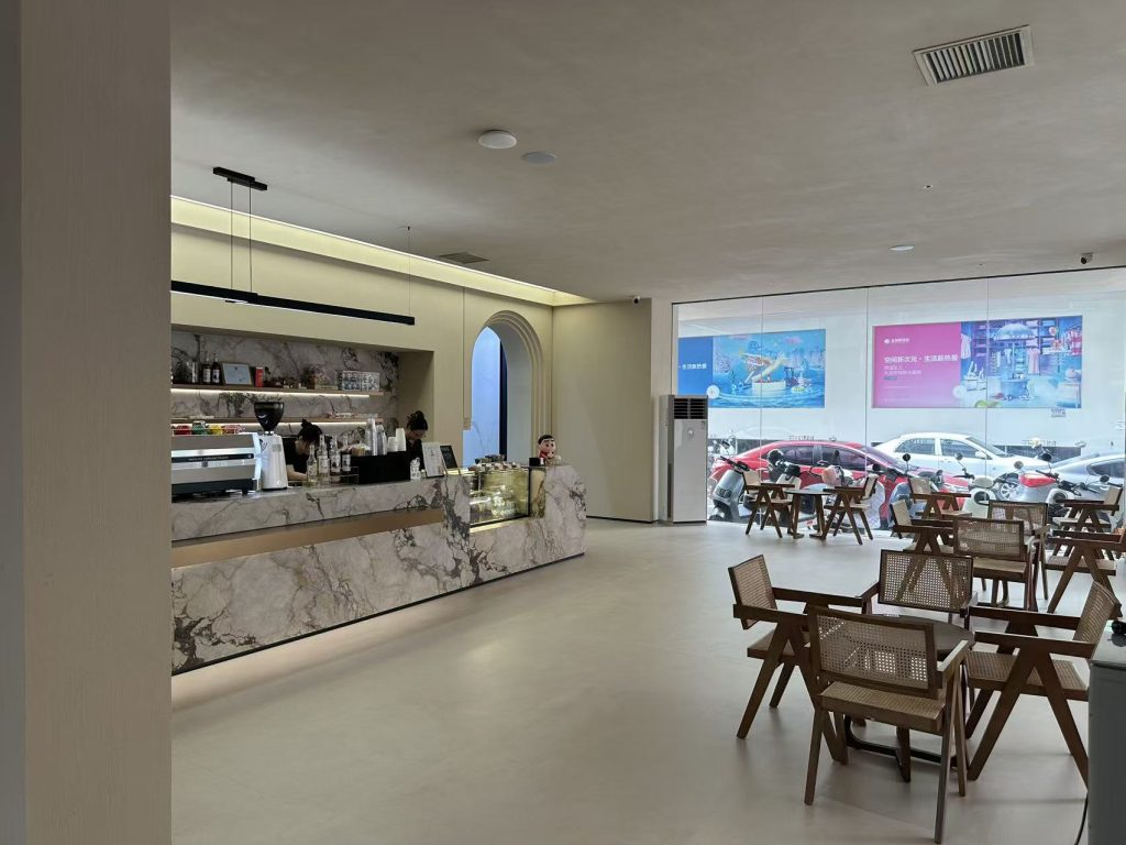 a coffee bar using sintered stone to make the counter top and floor