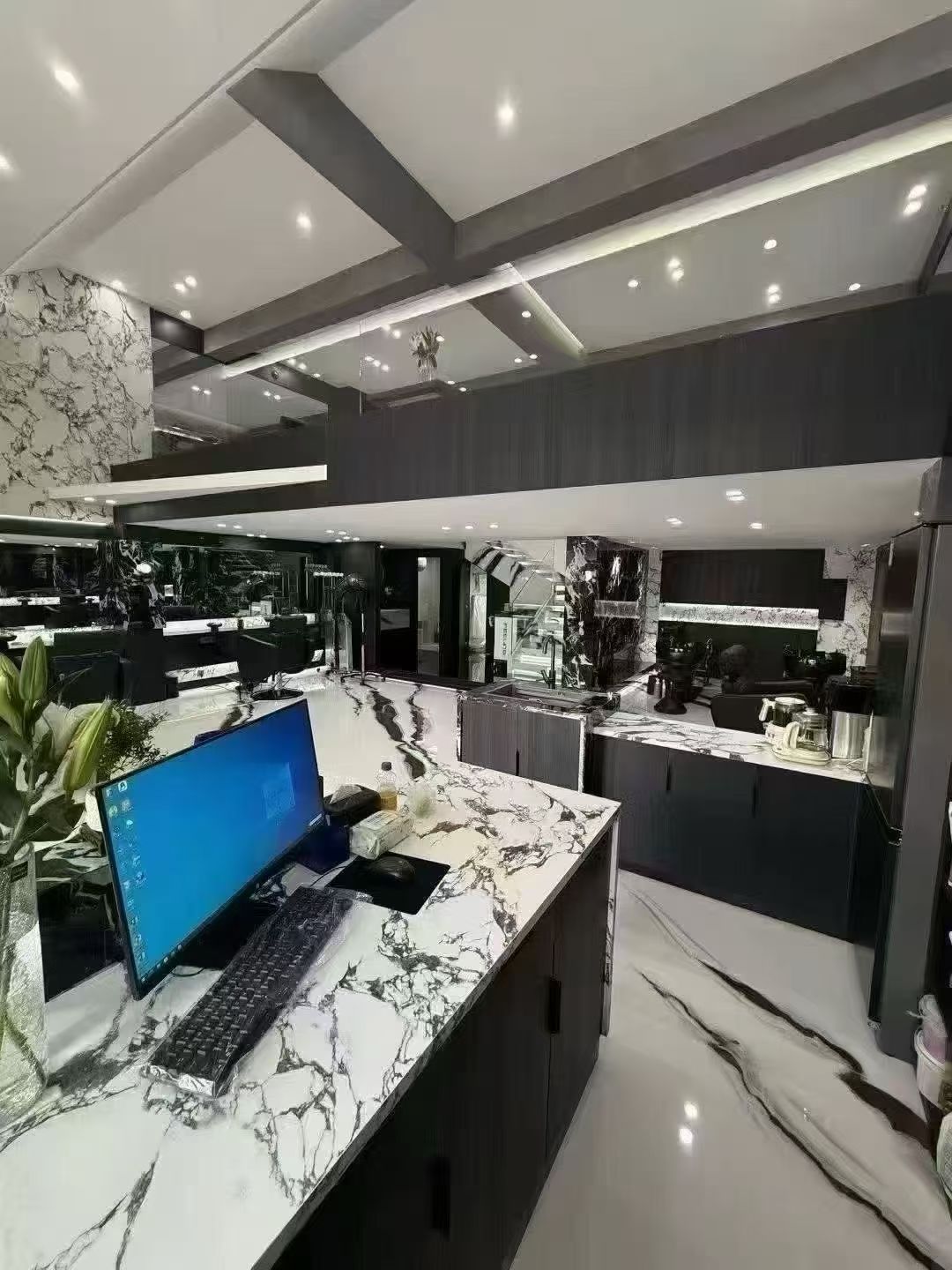 sintered stone panda white application in the barber shop with a counter using sintered stone