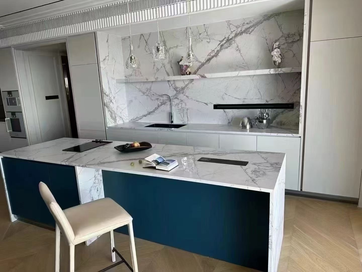 white sintered stone kitchen counter top and backsplash