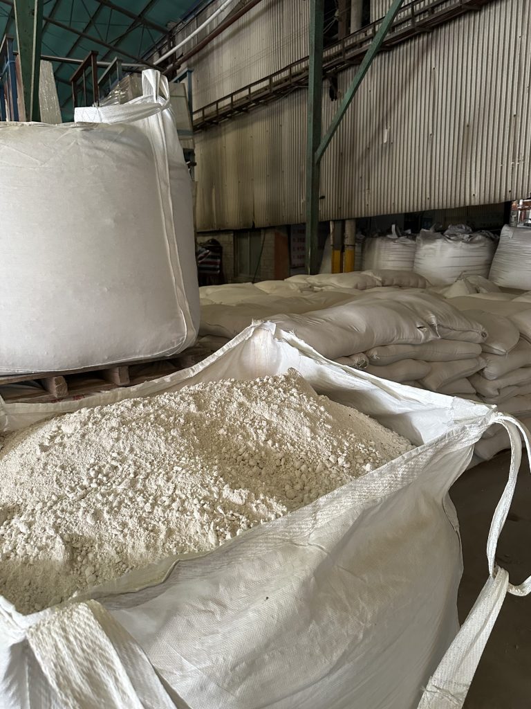 Kaolin-stacked-in-a-sintered-stone-warehouse-scaled