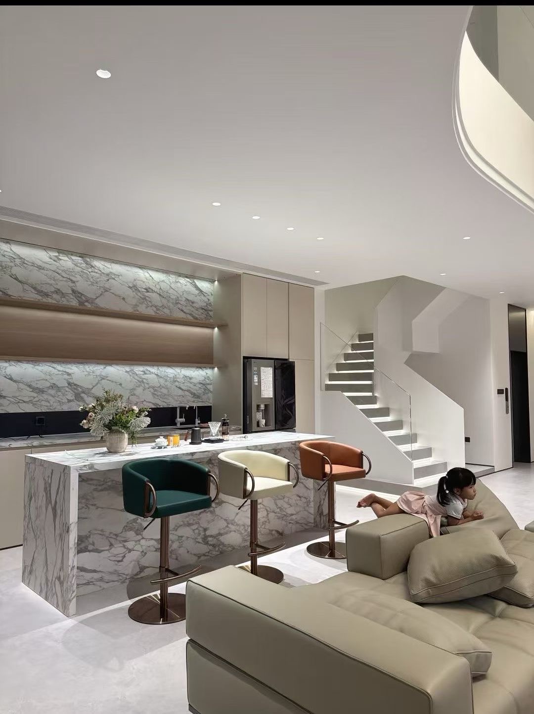 the-island-table-made-with-sintered-stone-and-a-sofa-placed-behide-it